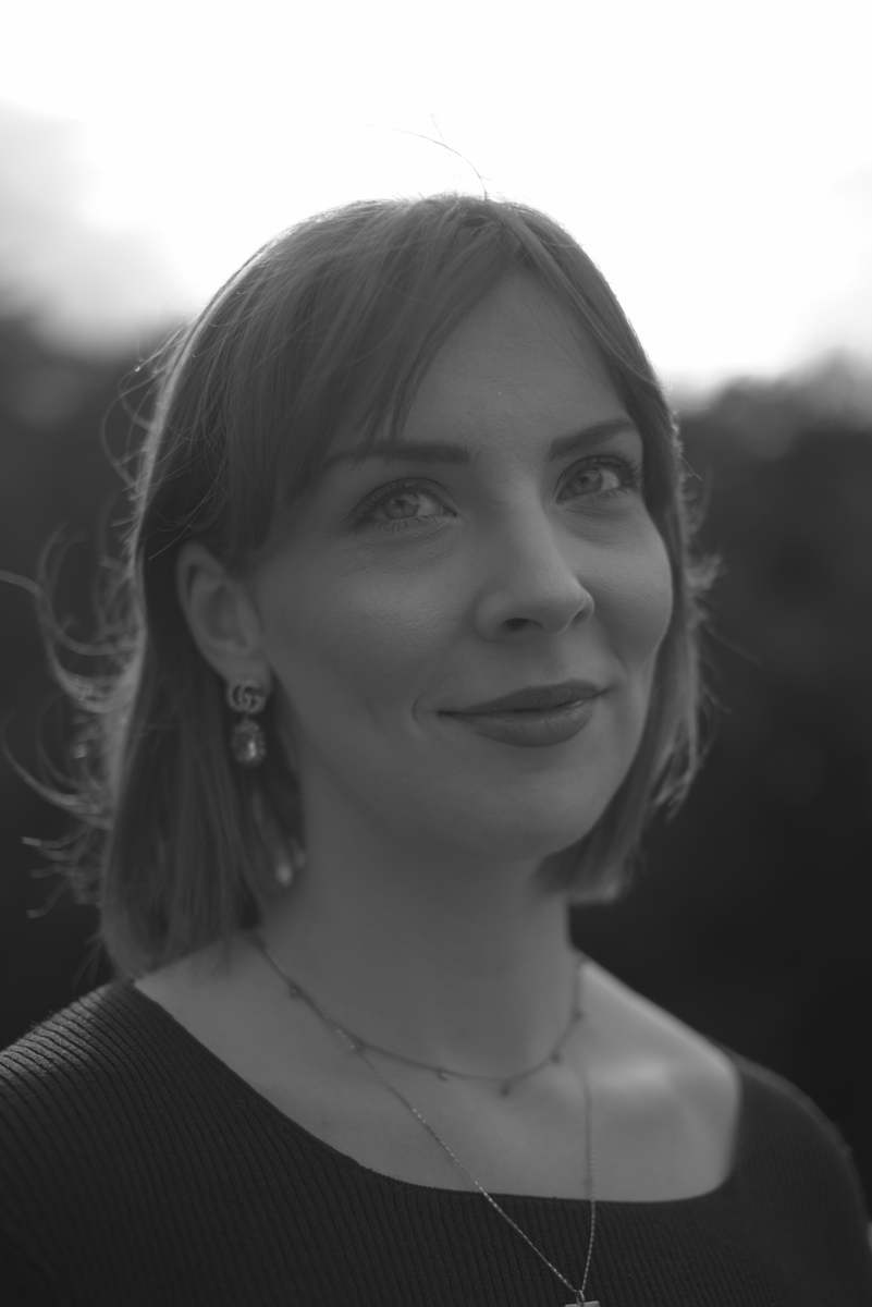 A normal-looking black-and-white portrait of a woman, rendered from the raw single-channel sensor data with no demosaicing.