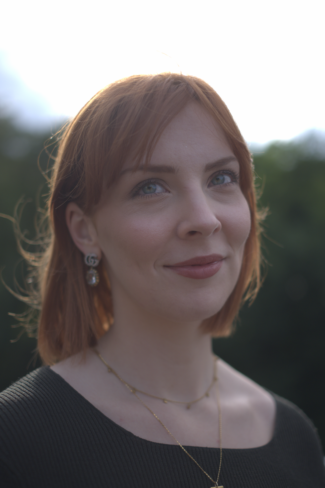 The portrait with no tone mapping, just clipping at 1.0 and gamma encoding. The brightest parts of the image are blown out to pure white; subtle highlight detail is lost.